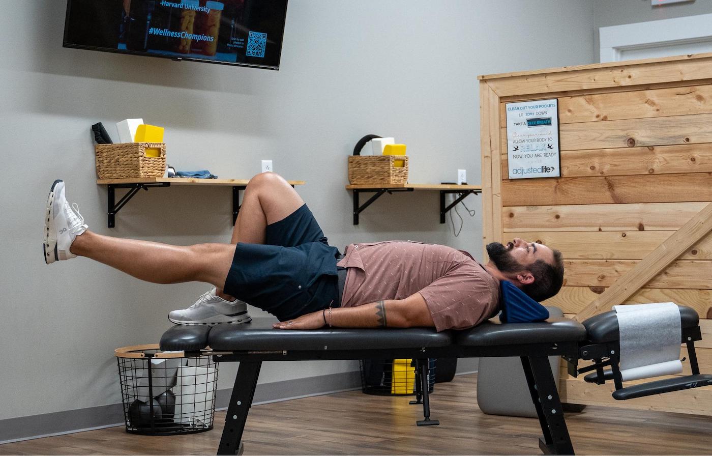 Chiropractor performing a chiropractic adjustment on a man in our Denver chiropractic care clinic